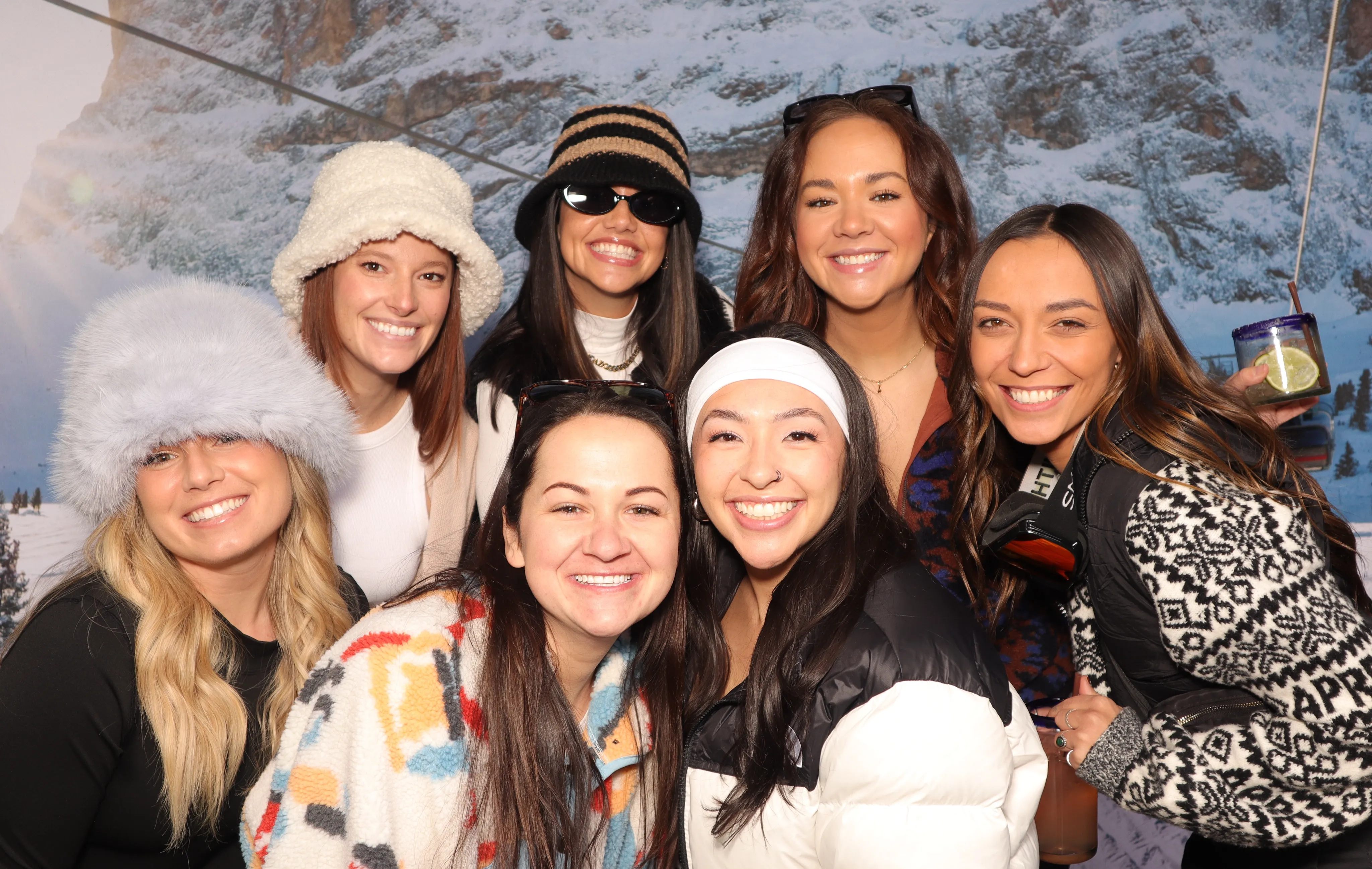 Guests using chalet-style props in an Après Ski photo booth