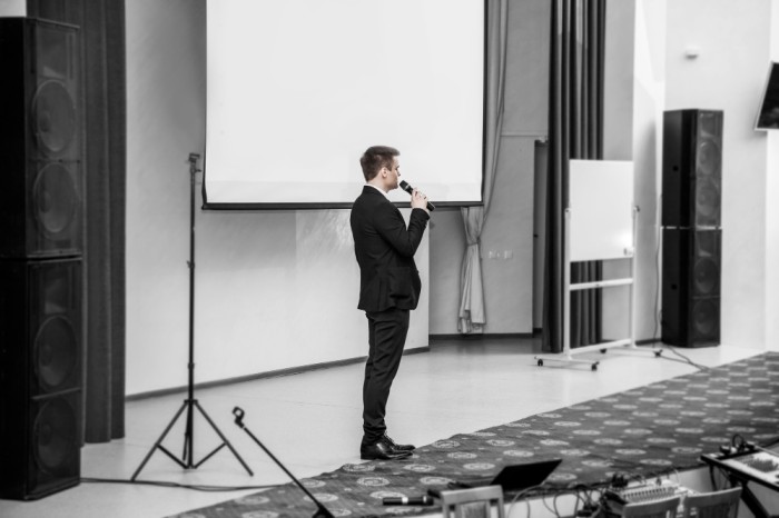 Corporate meeting audio services with distributed sound and presentation audio solutions