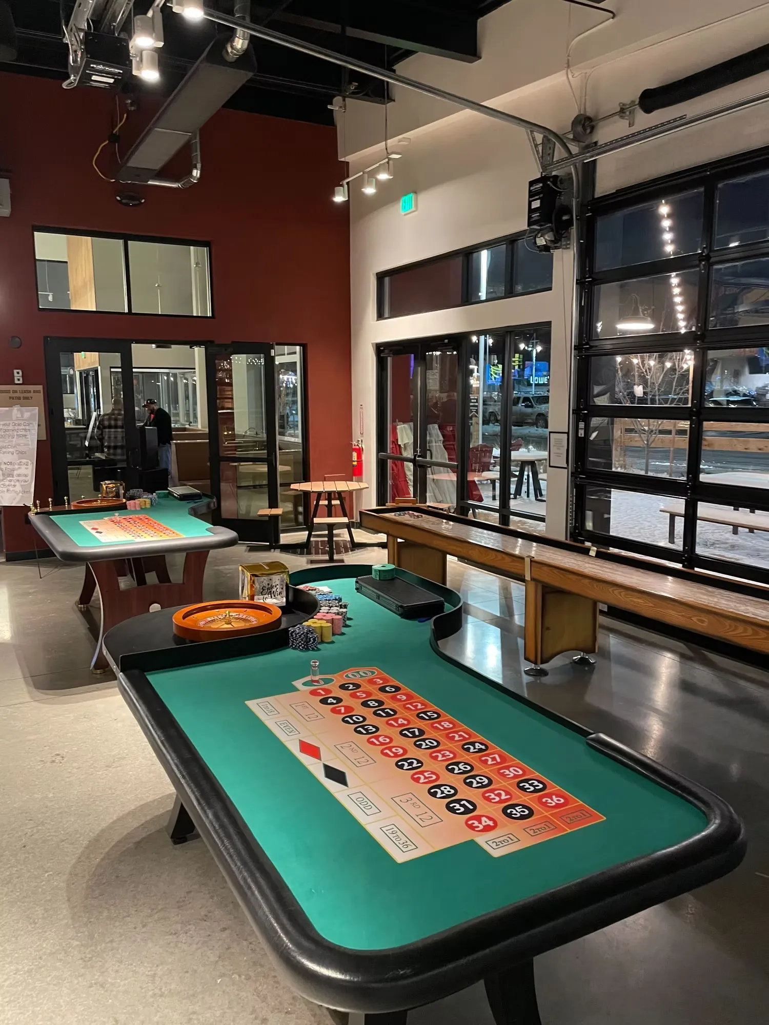 Professional casino dealer at roulette table during Denver casino party