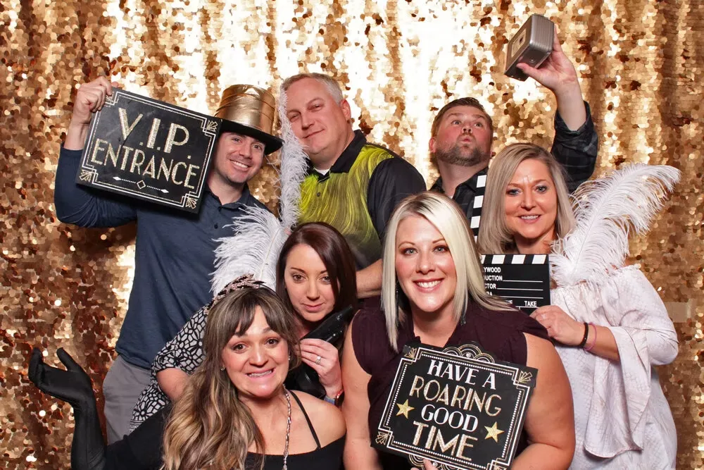 Group with gold backdrop and props