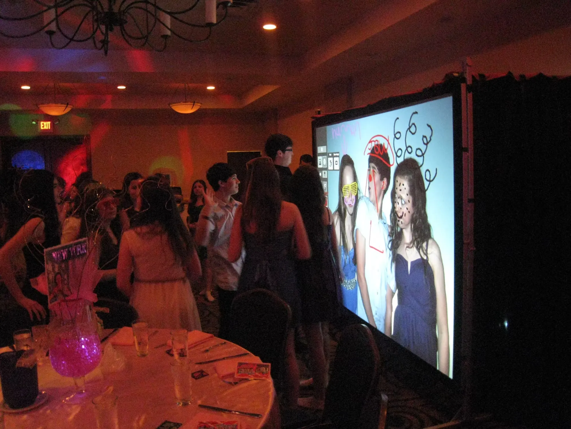 Creative graffiti wall photo booth experience at corporate event