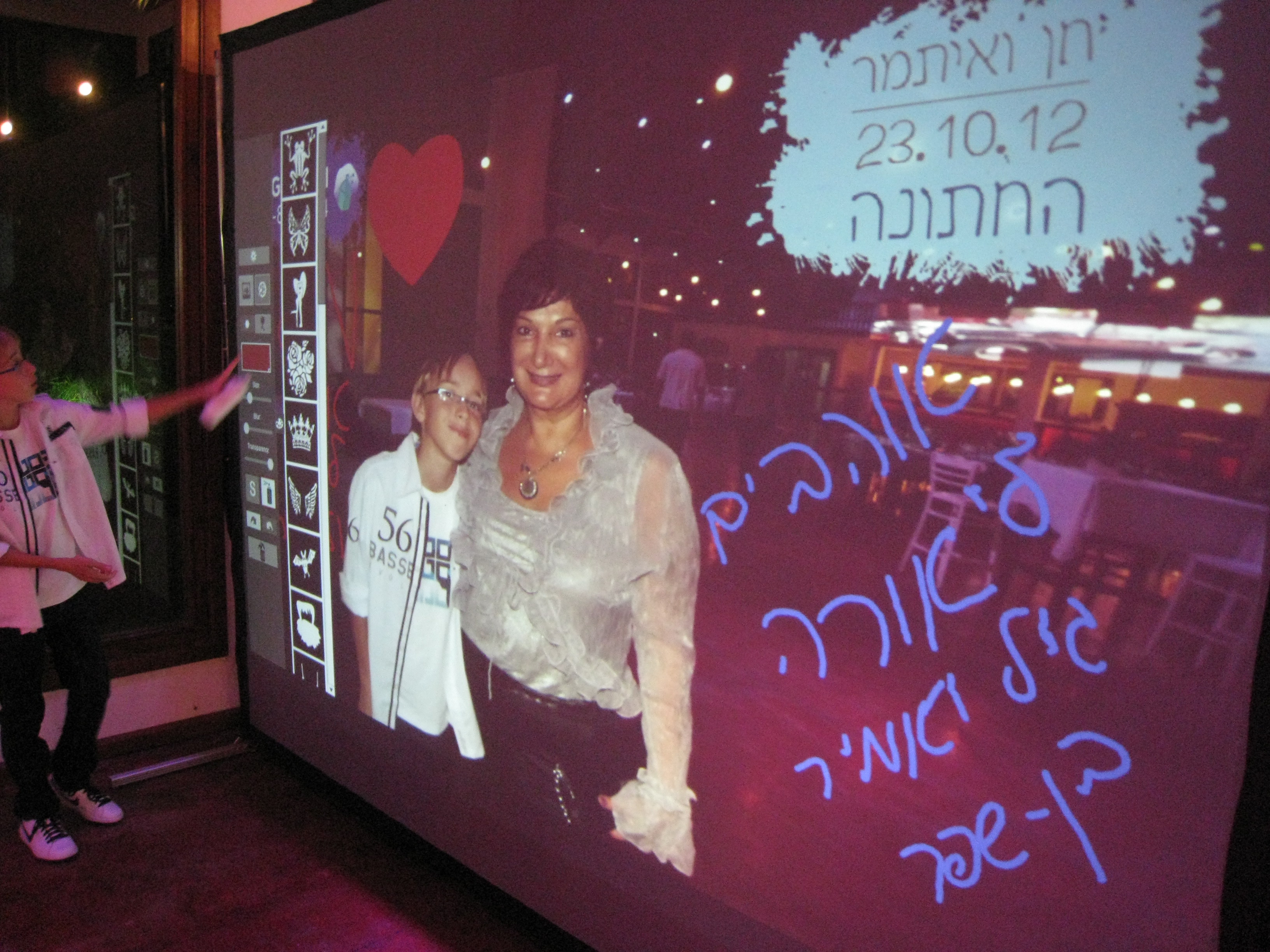 Creative graffiti wall photo booth experience at corporate event