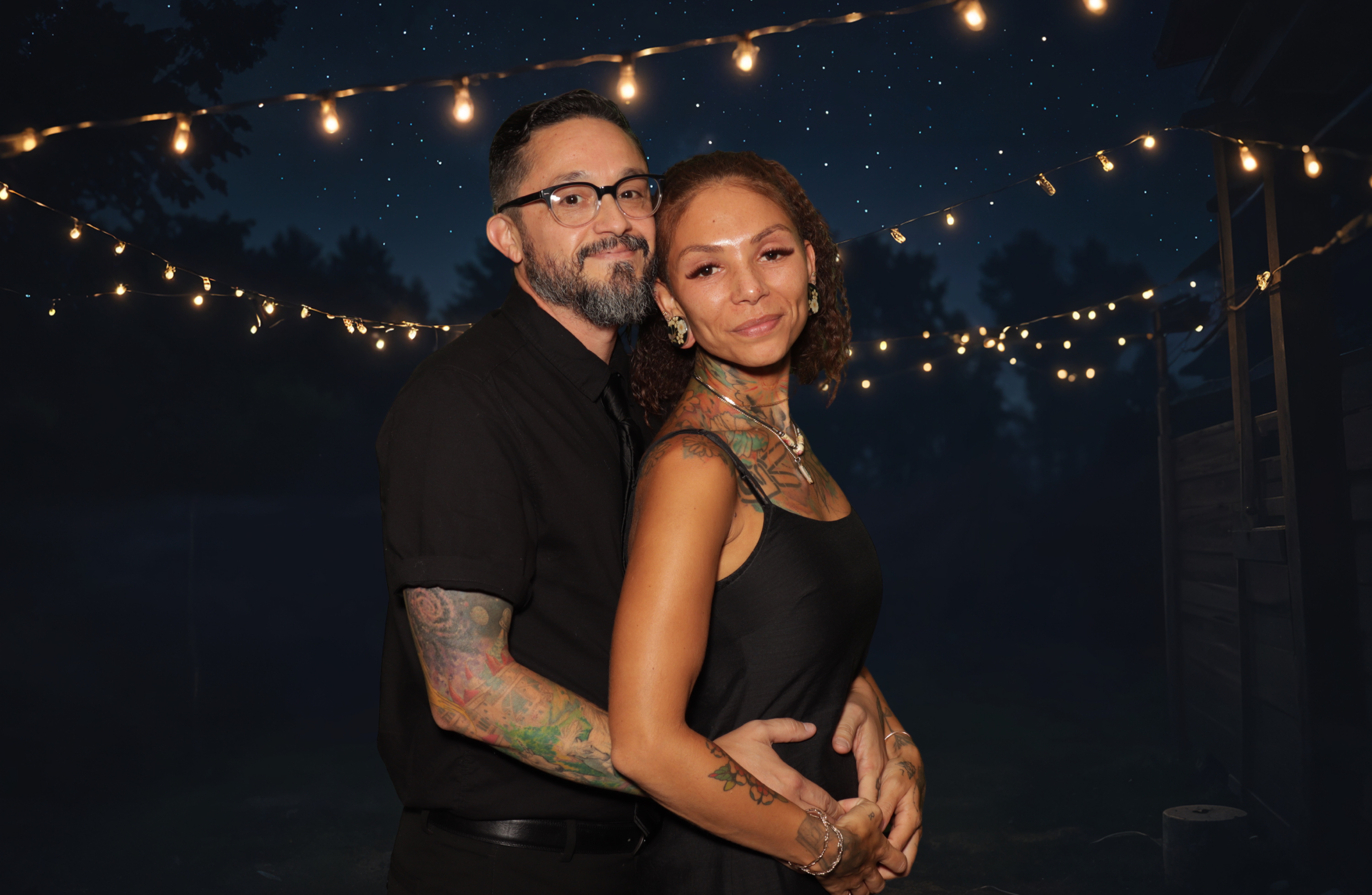 VIP red carpet couple posing with branded step and repeat green screen photo booth