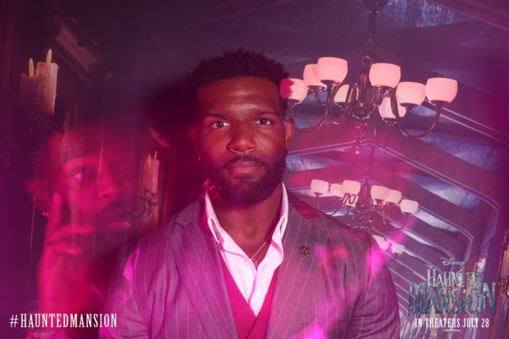 Lady with no expression with a ghost around her with its hands up