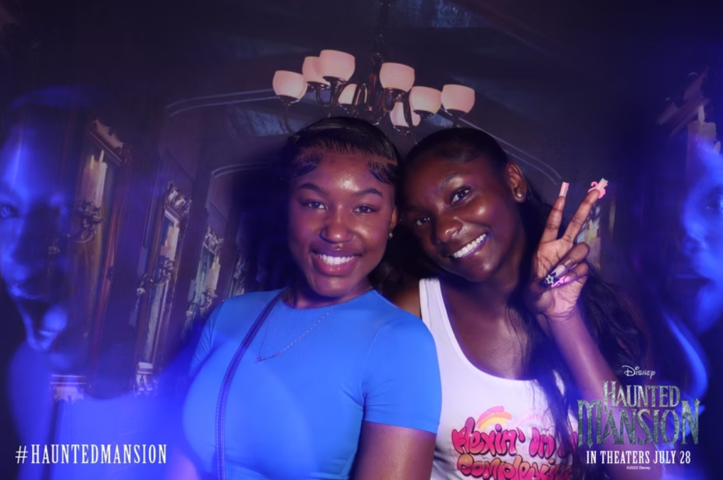 Guy looking up while a ghost stands by him looking forwards