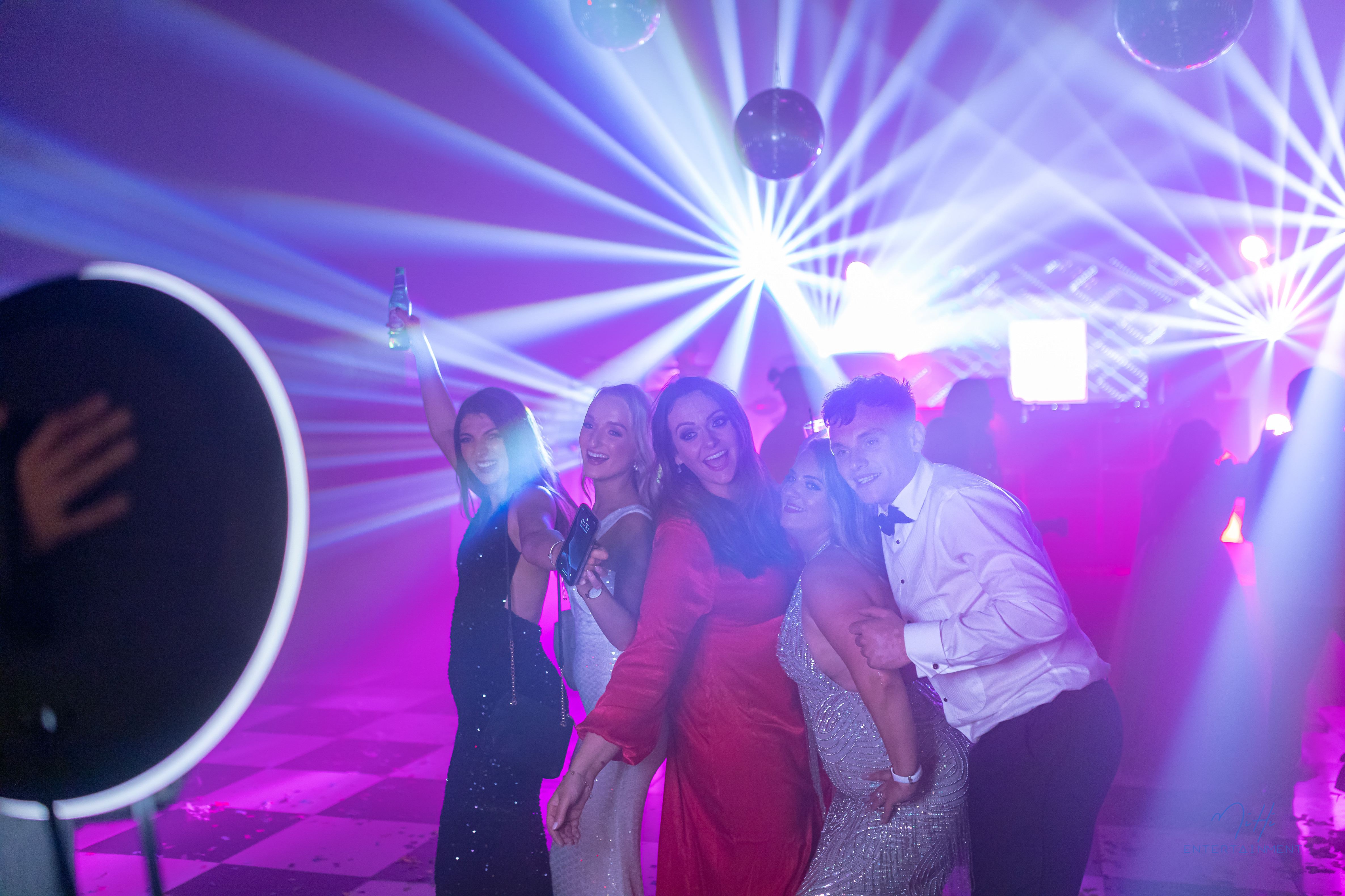 Professional mobile photographer with ring light at wedding event