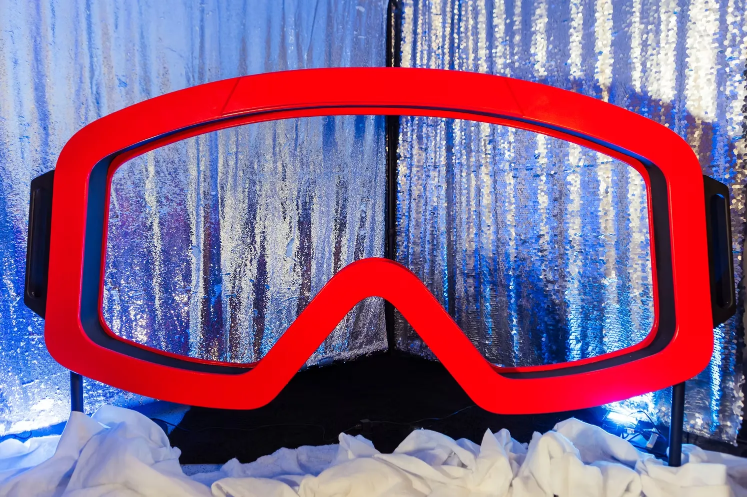 Ski goggle photo booth with customizable accent lighting creating dramatic winter wonderland display