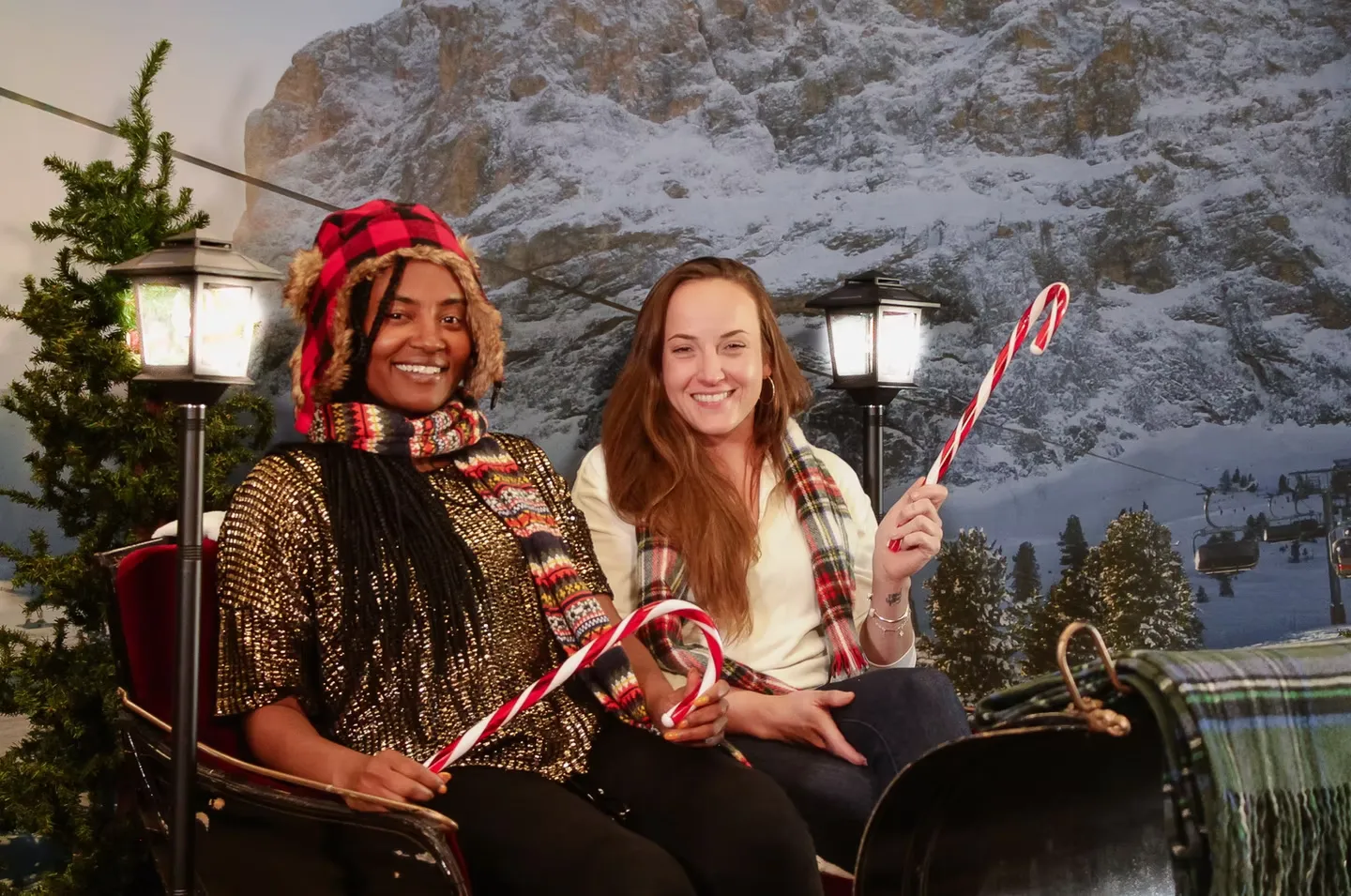 Holiday sleigh photo booth with open sleigh and festive winter backdrop creating magical holiday scene