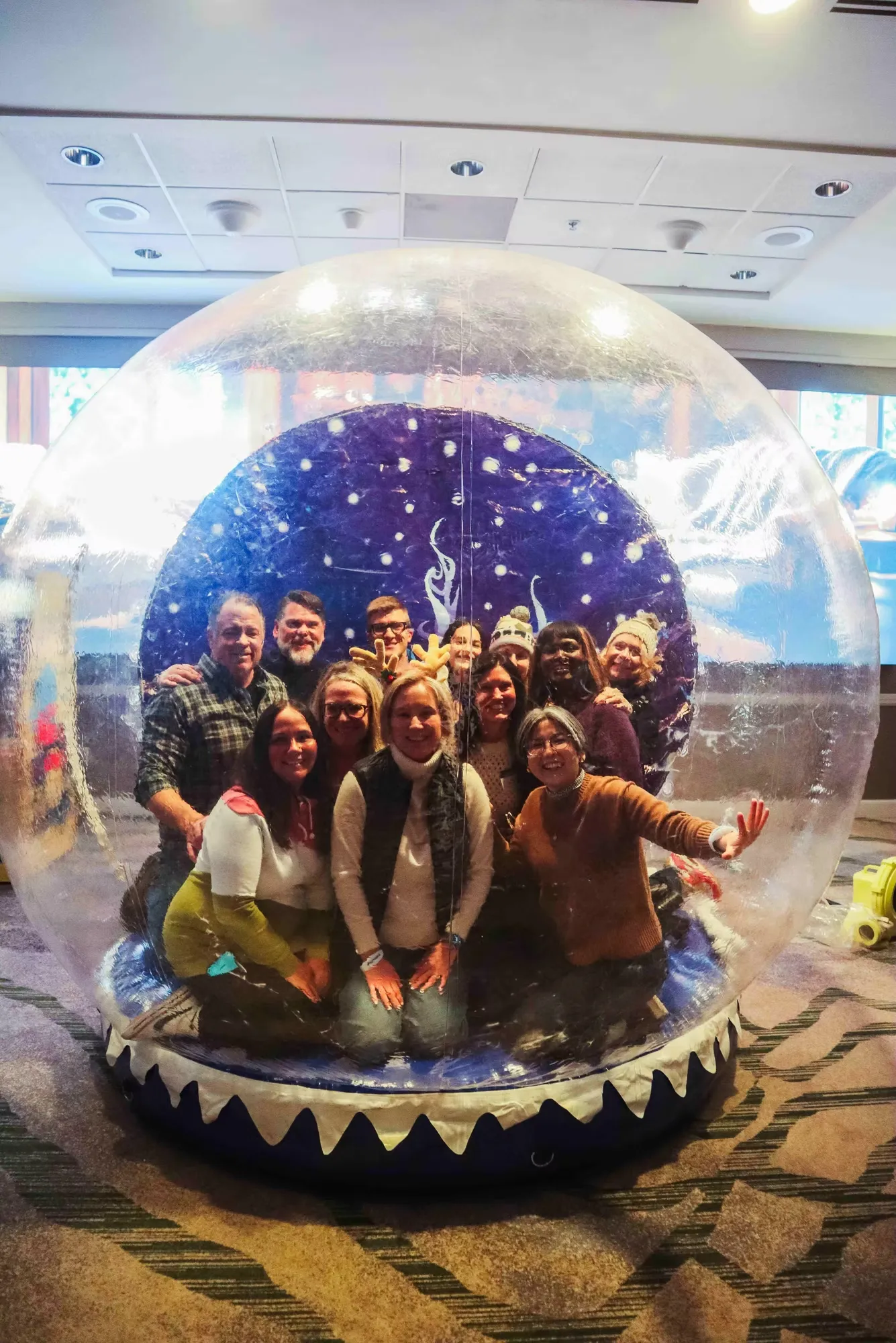 Snow globe photo booth set with GIF and Boomerang options capturing fun animated moments for corporate events