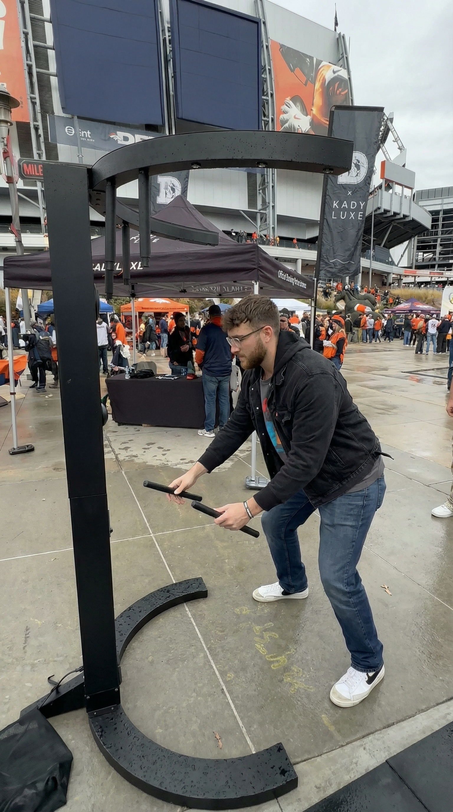 People playing Stick Drop Reaction Game at an indoor event