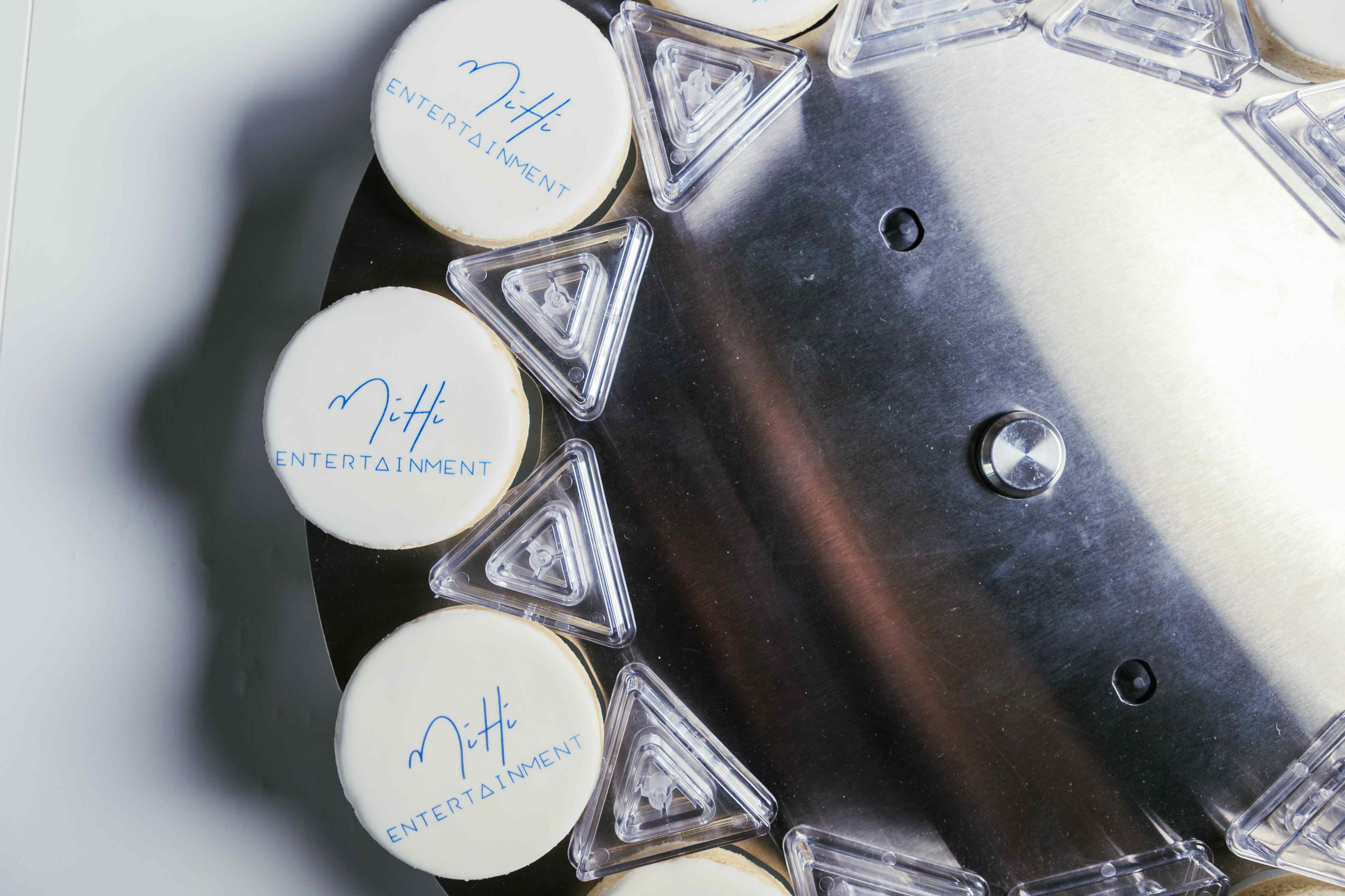 Edible image printer creating custom branded cookies at corporate event