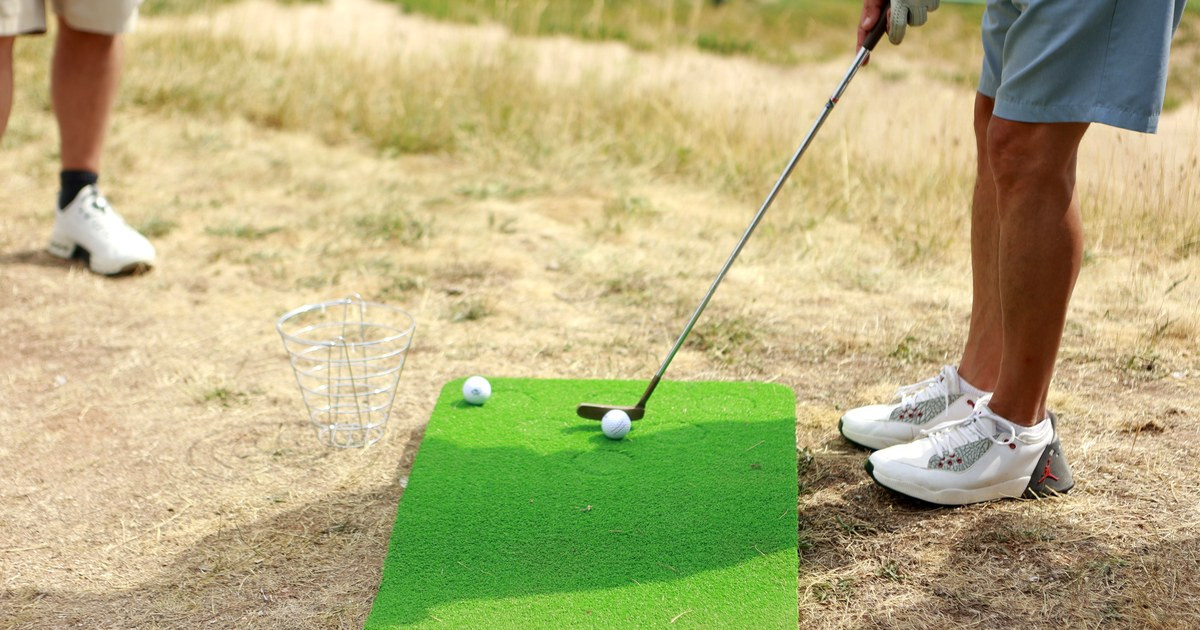 Close detail of putter and ball on turf during the Putt stage of a Multi-Step golf activation.