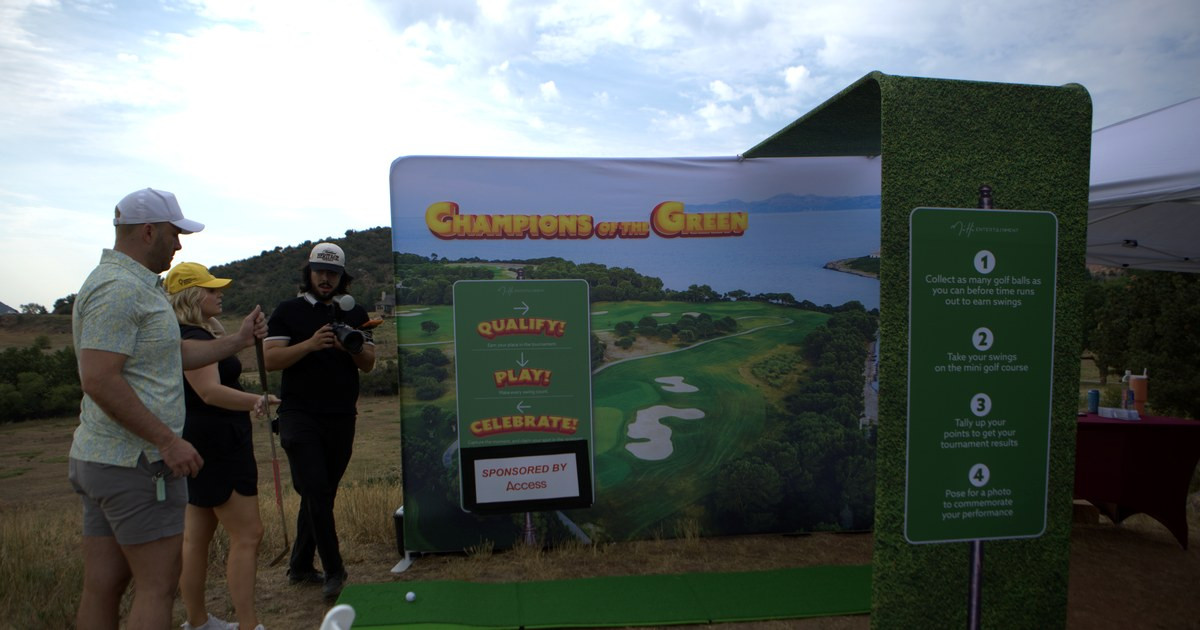 Champions of the Green station with guests and Access sponsor branding at a Denver Multi-Step golf activation.